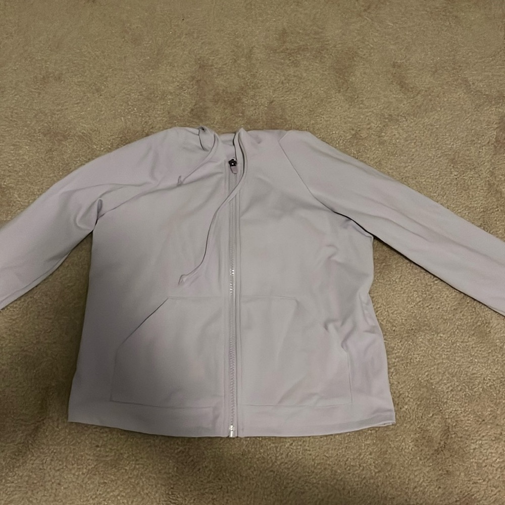 Purple cropped athletic jacket.